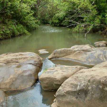 The rocks do not stop the endless flow of water.