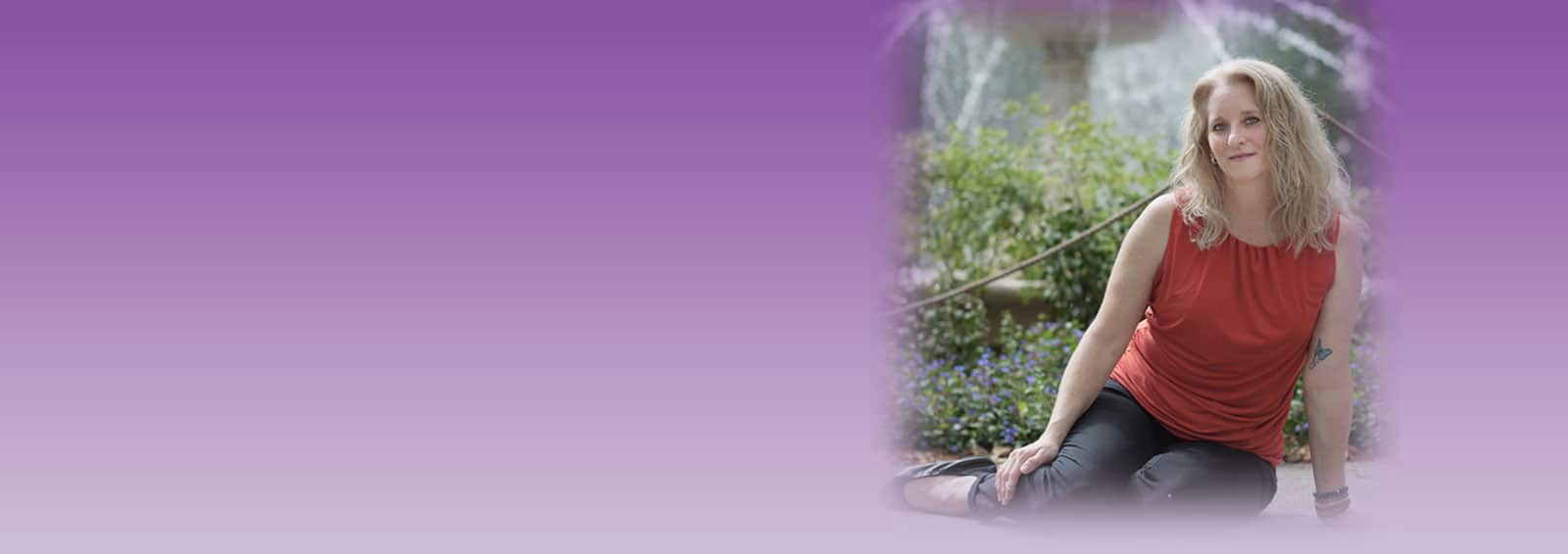 Karen Kubicko sitting in front of a water fountain