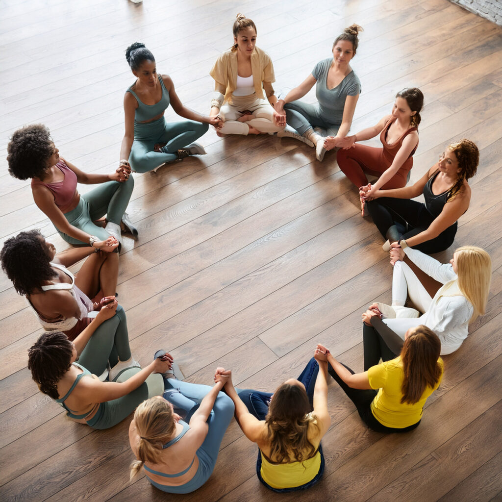 Woman sittin in circle group discussion